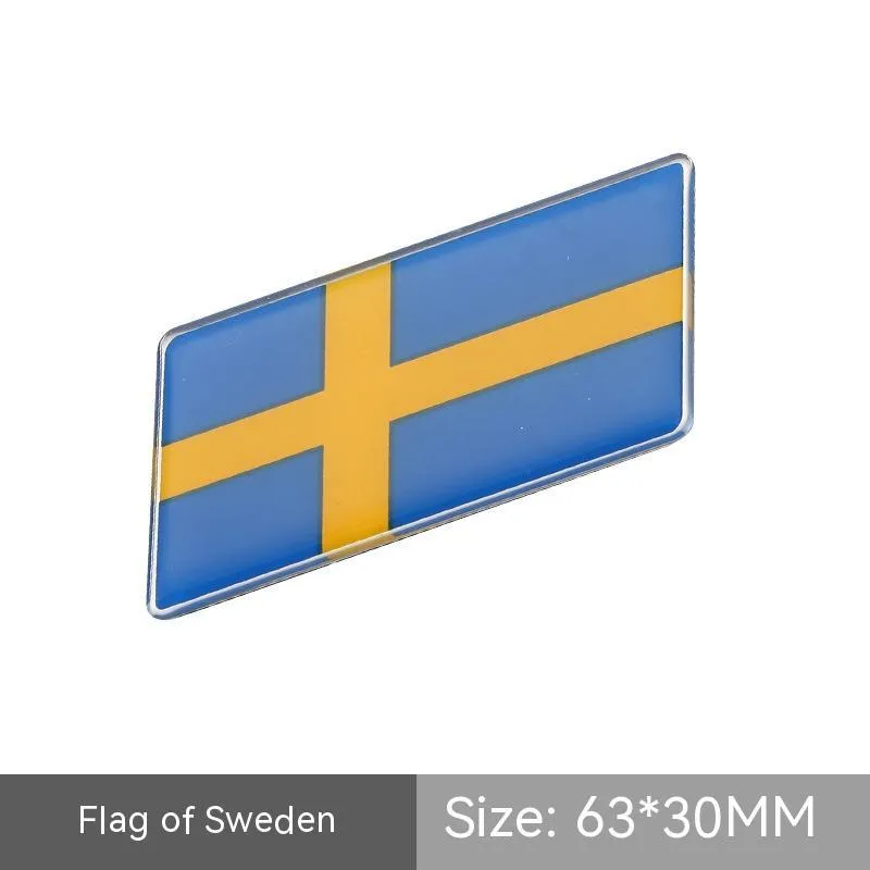 Aluminium national flag car sticker with metal crystal tail tag measuring 6.3cm by 3cm showing parallelogram shape