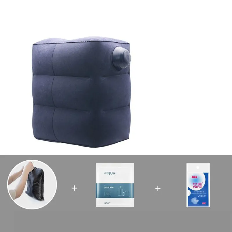 Gray inflatable foot pad with push-on button and adjustable storage bag containing travel accessories
