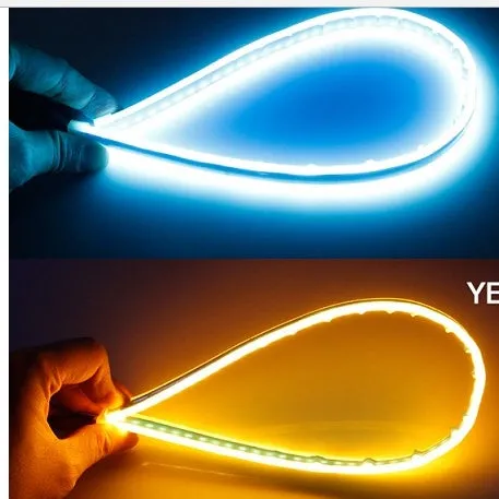 60cm ultra-thin car LED tear light guide strip in white yellow two-colour mode on a dark background