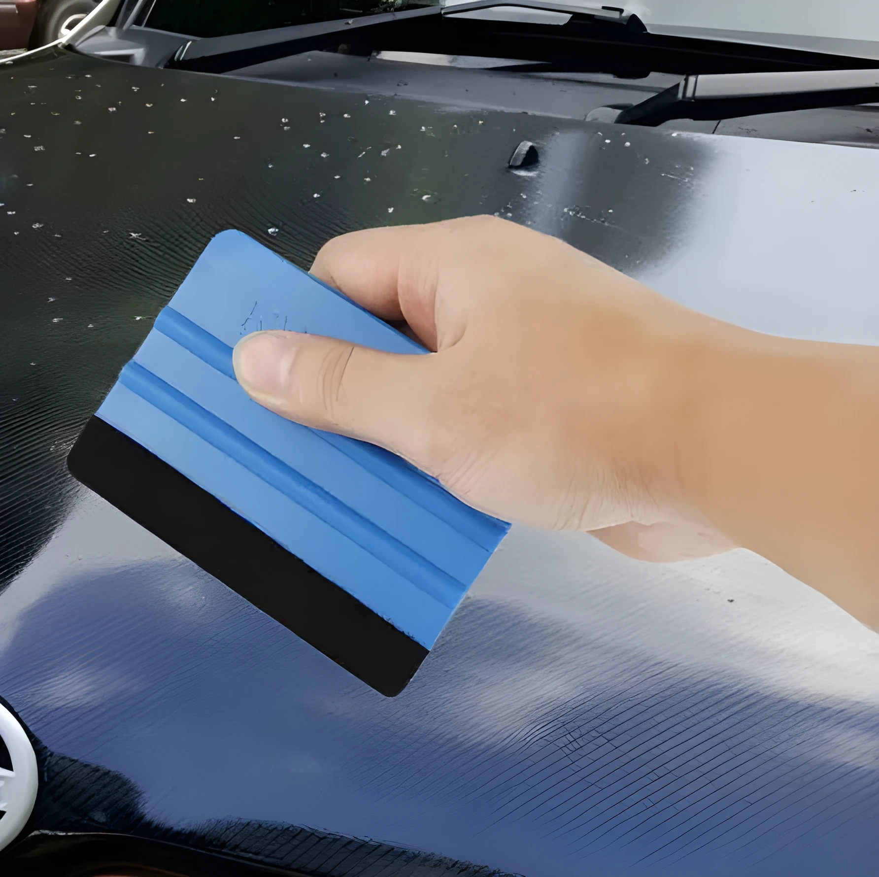 Blue automotive film scraper made from PP plastic, measuring 125x80mm, designed for car decal removal