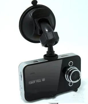 K6000 car dash cam with 120 degree wide angle lens mounted on front windshield in black finish