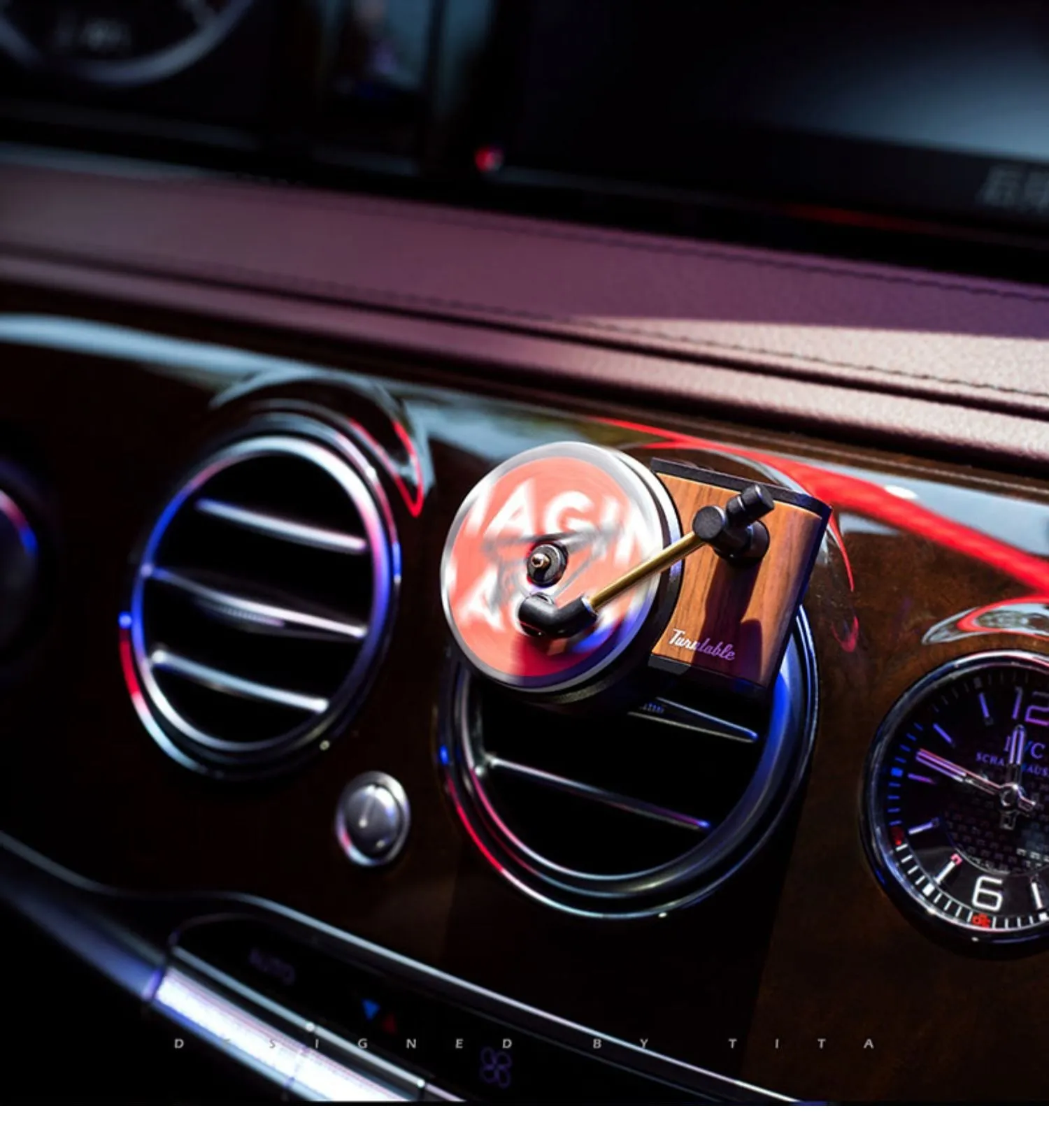 Brown alloy car perfume clip with record locomotive design on car air vent