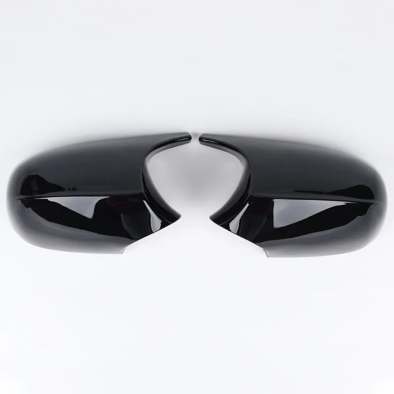 Pair of black ABS plastic rearview mirror shells for BMW 3 Series E90 car.