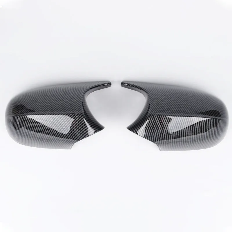 Pair of black ABS plastic rearview mirror shells for BMW 3 Series E90 car.