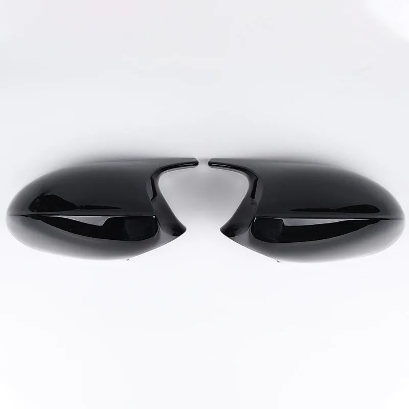 Pair of black ABS plastic rearview mirror shells for BMW 3 Series E90 car.
