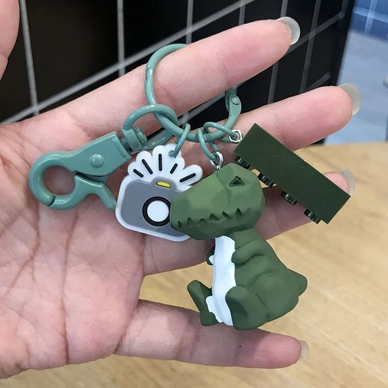 Acrylic geometric animal keychain in dinosaur style with colour buckle detail on a key ring