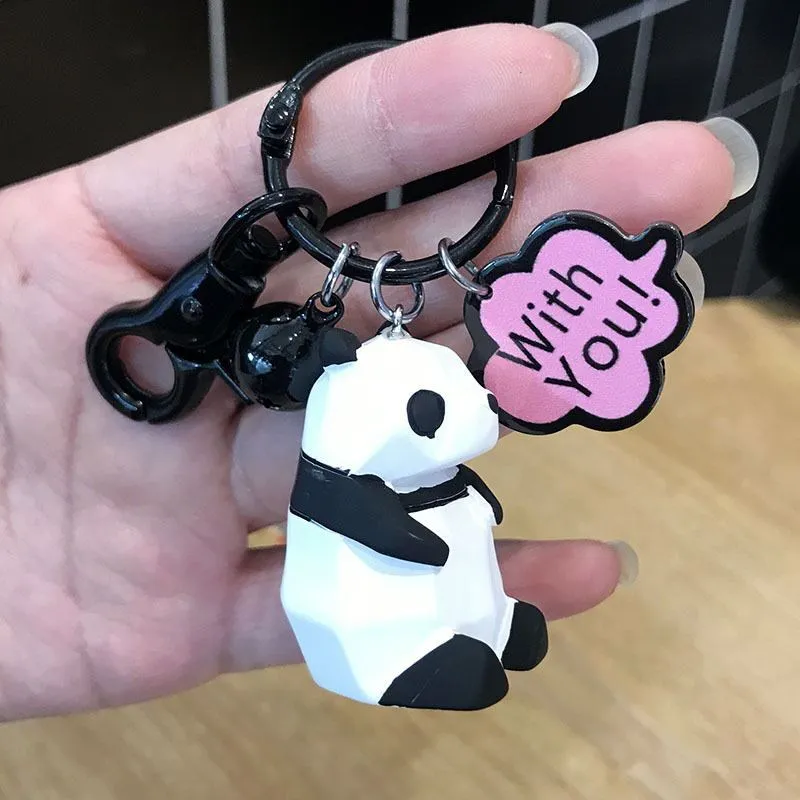 Acrylic geometric animal keychain in dinosaur style with colour buckle detail on a key ring