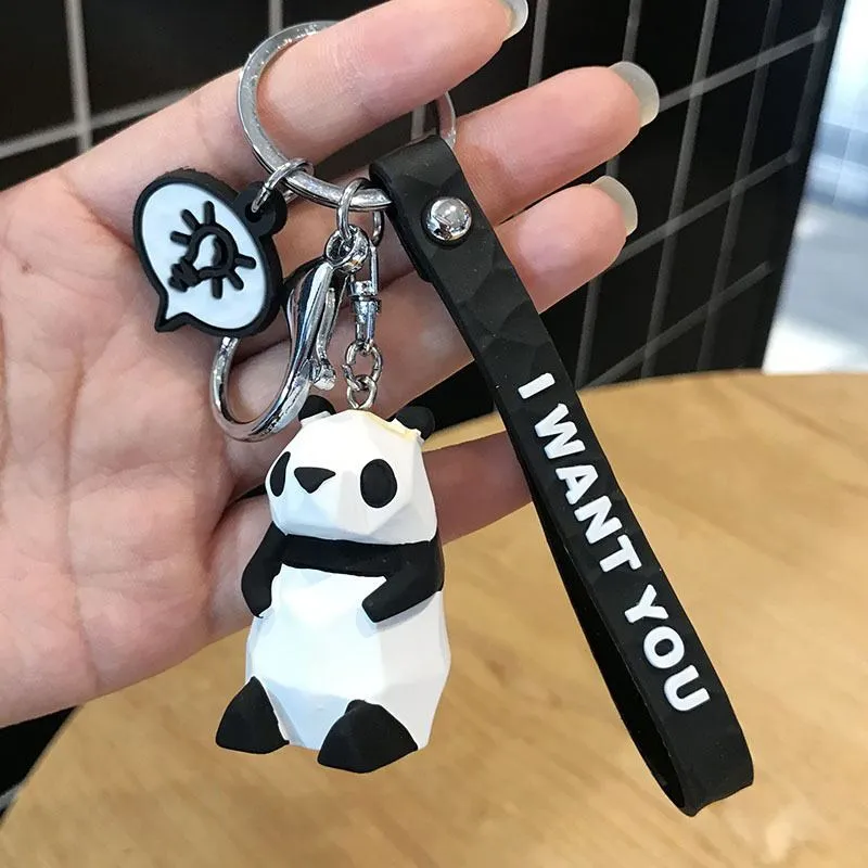 Acrylic geometric animal keychain in dinosaur style with colour buckle detail on a key ring