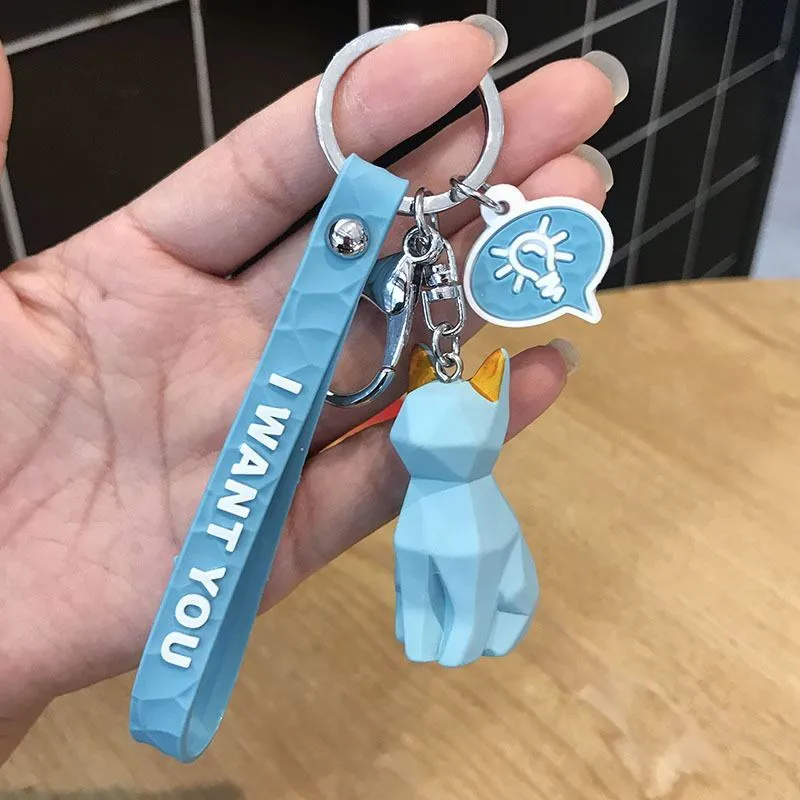 Acrylic geometric animal keychain in dinosaur style with colour buckle detail on a key ring