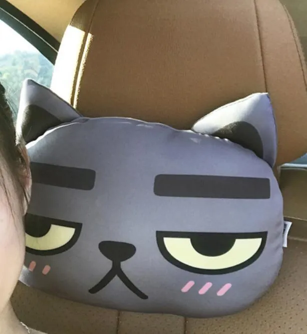 Cat car headrest pillow with cartoon print, oblong shape, removable cover for adult seat