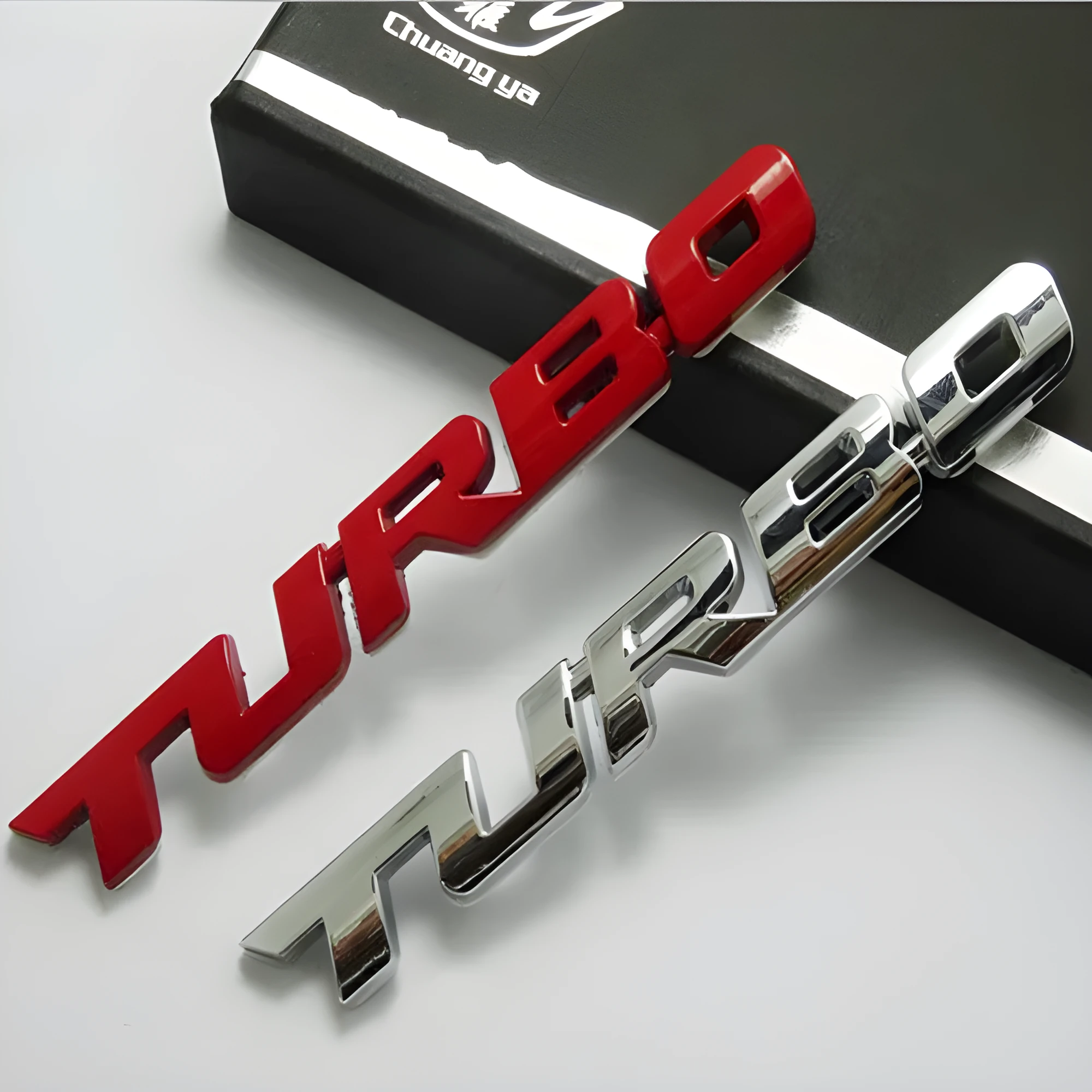 3D TURBO stereo car sticker in zinc alloy with raised letter design, available in black, red, and silver colours