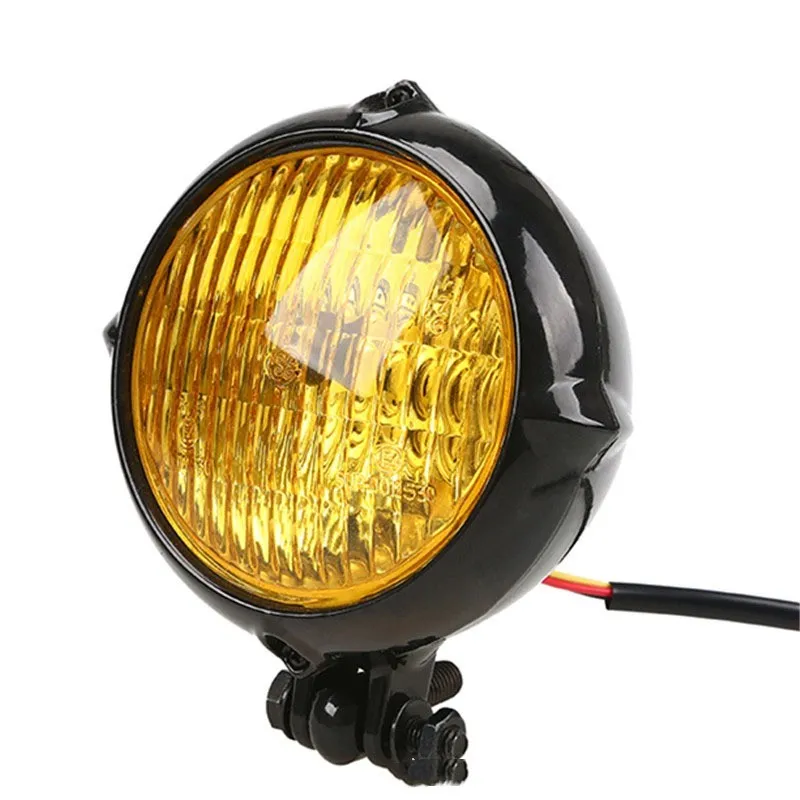 Black retro-style Harley motorcycle headlight with an 8cm diameter cast aluminium housing.