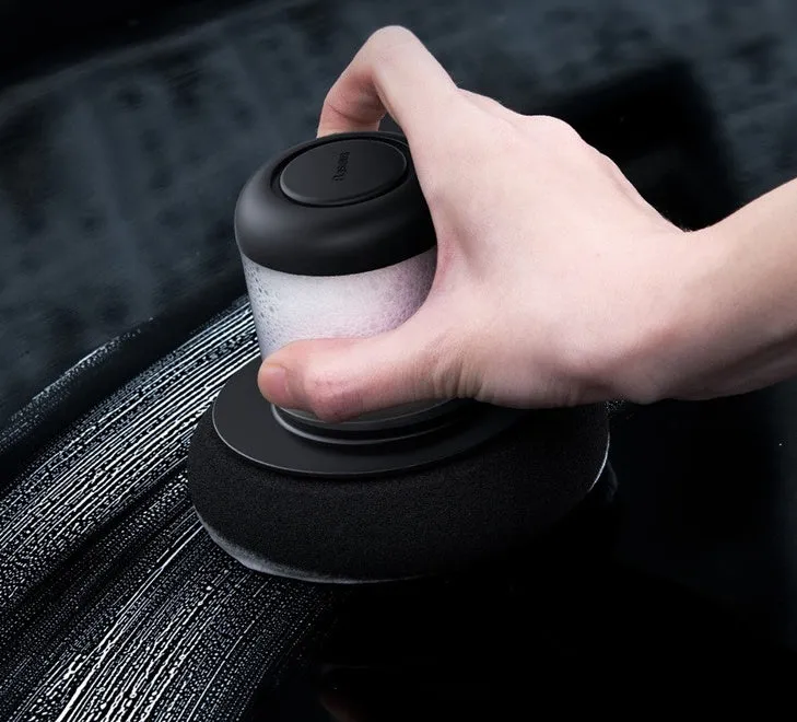 Dual-action car polishing machine with 6 speed settings in black ABS PC body with sponge pad attached