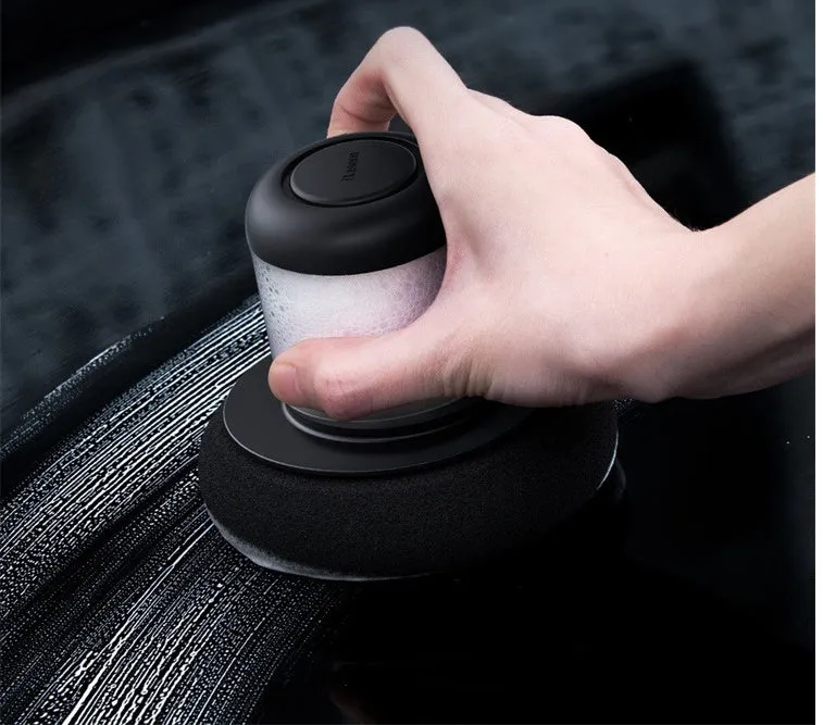 Dual-action car polishing machine with 6 speed settings in black ABS PC body with sponge pad attached