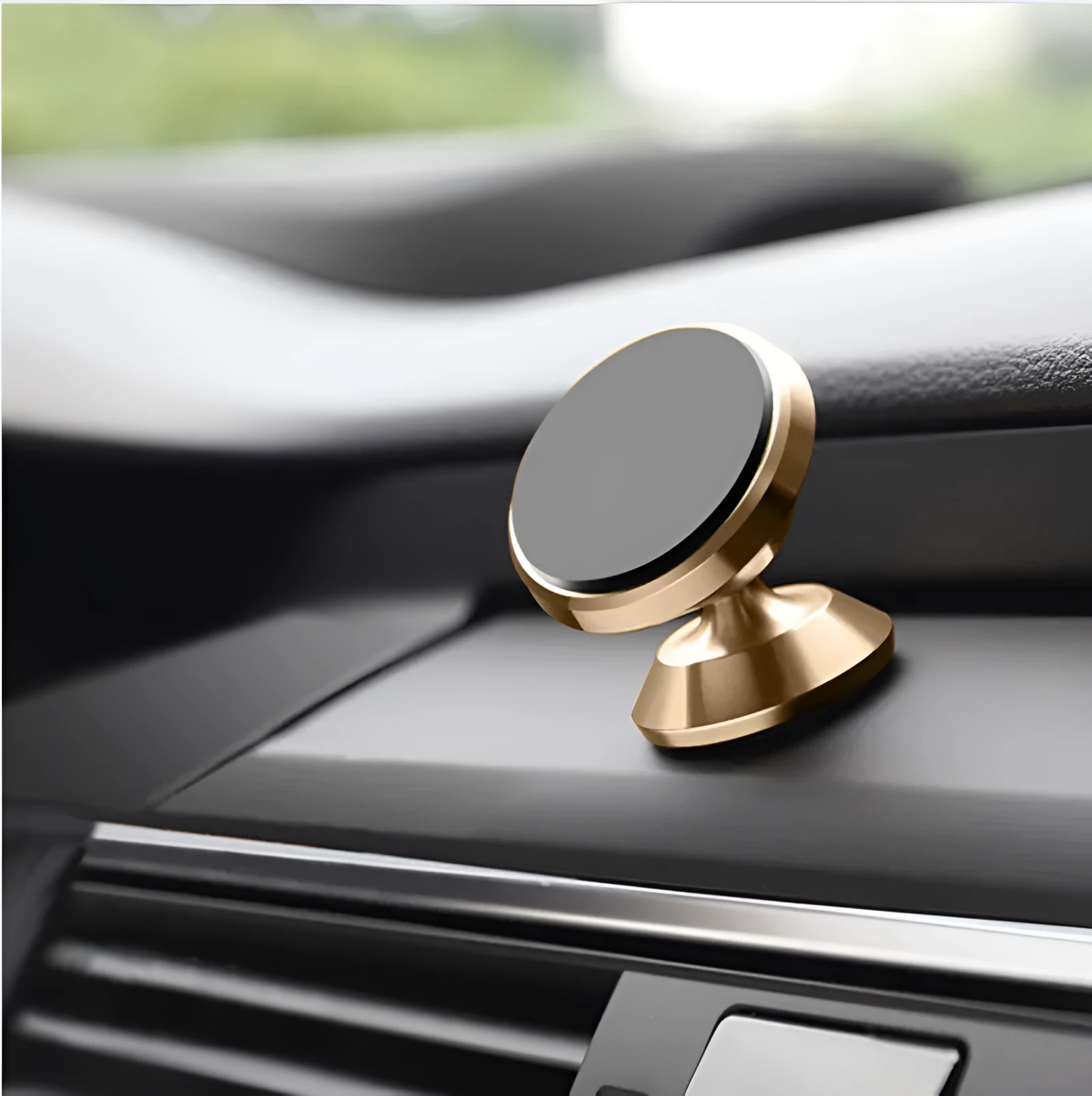 Magnetic car air outlet phone bracket in black attached to a vehicle vent