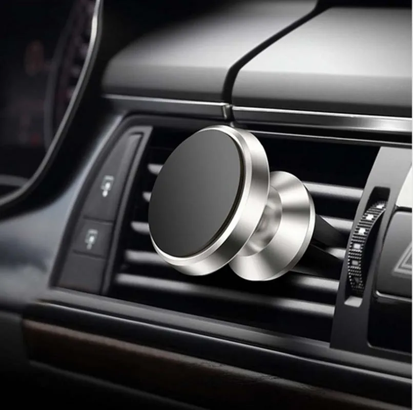 Magnetic car air outlet phone bracket in black attached to a vehicle vent