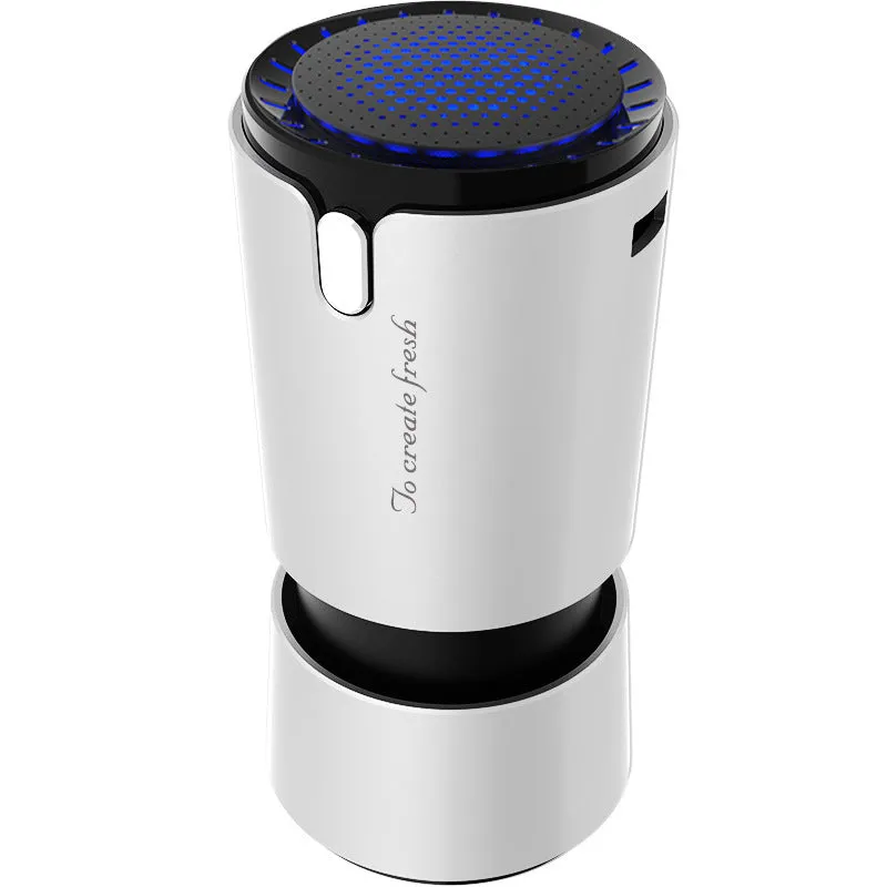 Portable mini car air purifier with True HEPA filter, USB cable, compact silver cup shape on car cup holder