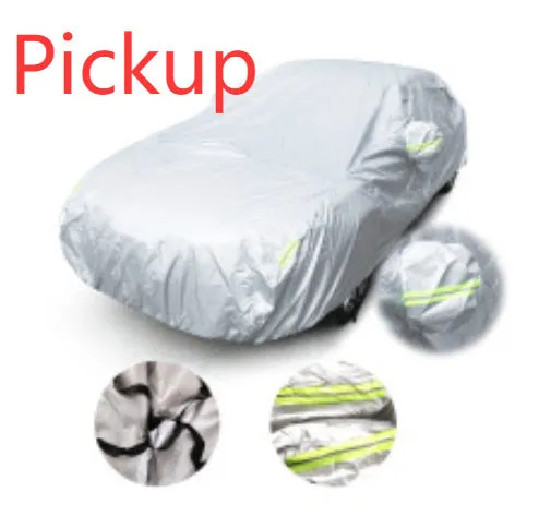 Silver-coated black taffeta universal car cover fitted over a sedan in outdoor parking