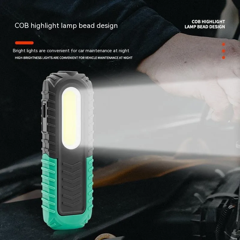 Black and green auto repair work light with USB charging cable for vehicle maintenance
