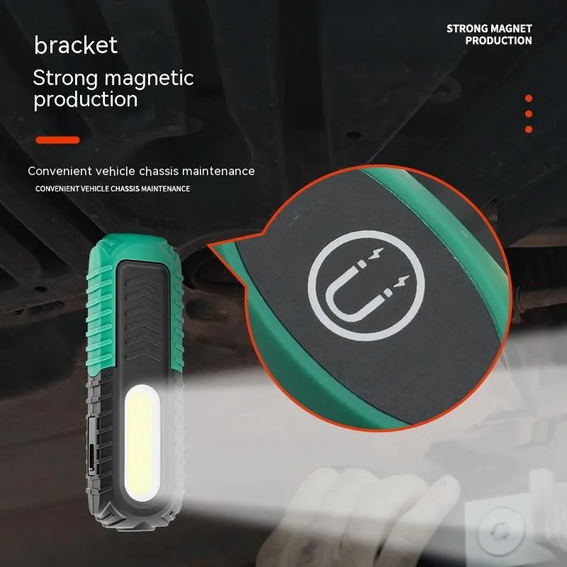 Black and green auto repair work light with USB charging cable for vehicle maintenance