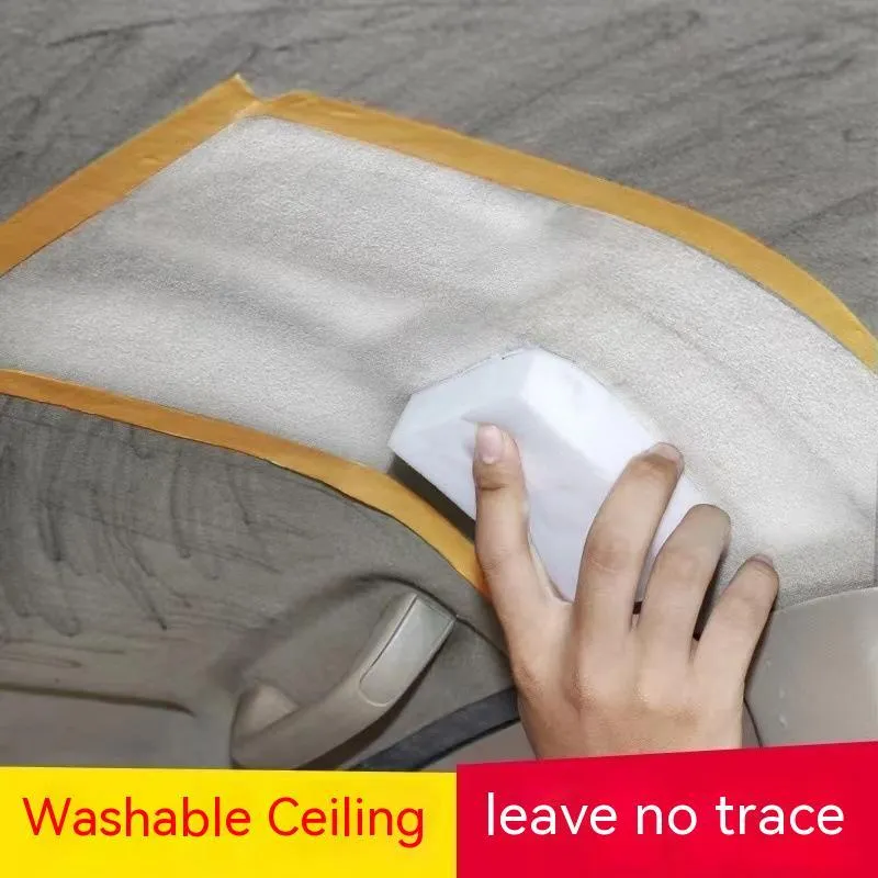 Bottle of enzyme-based fabric ceiling cleaner with towel and sponge wipes on a car roof