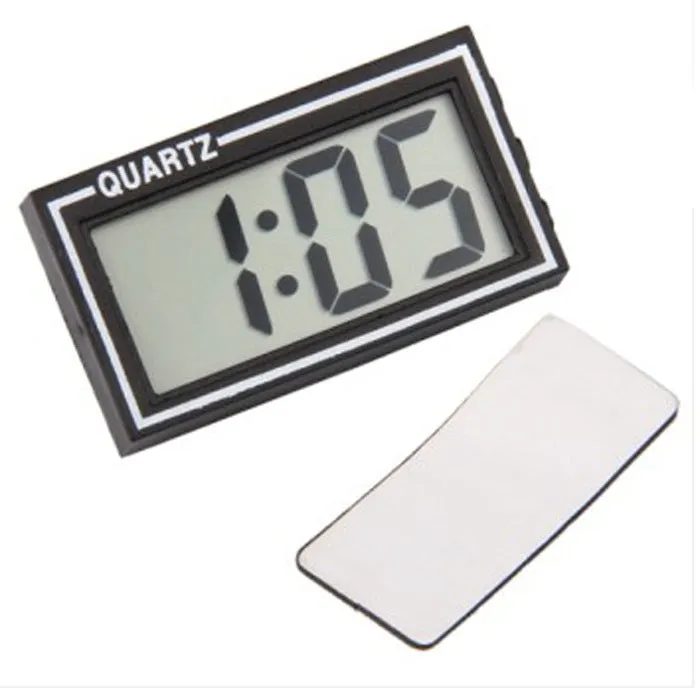 Battery-powered car clock with plastic case and ordinary glass mirror on a dashboard