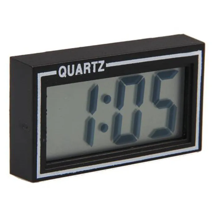Battery-powered car clock with plastic case and ordinary glass mirror on a dashboard