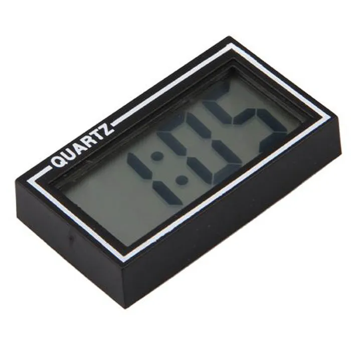 Battery-powered car clock with plastic case and ordinary glass mirror on a dashboard