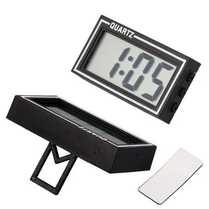 Battery-powered car clock with plastic case and ordinary glass mirror on a dashboard