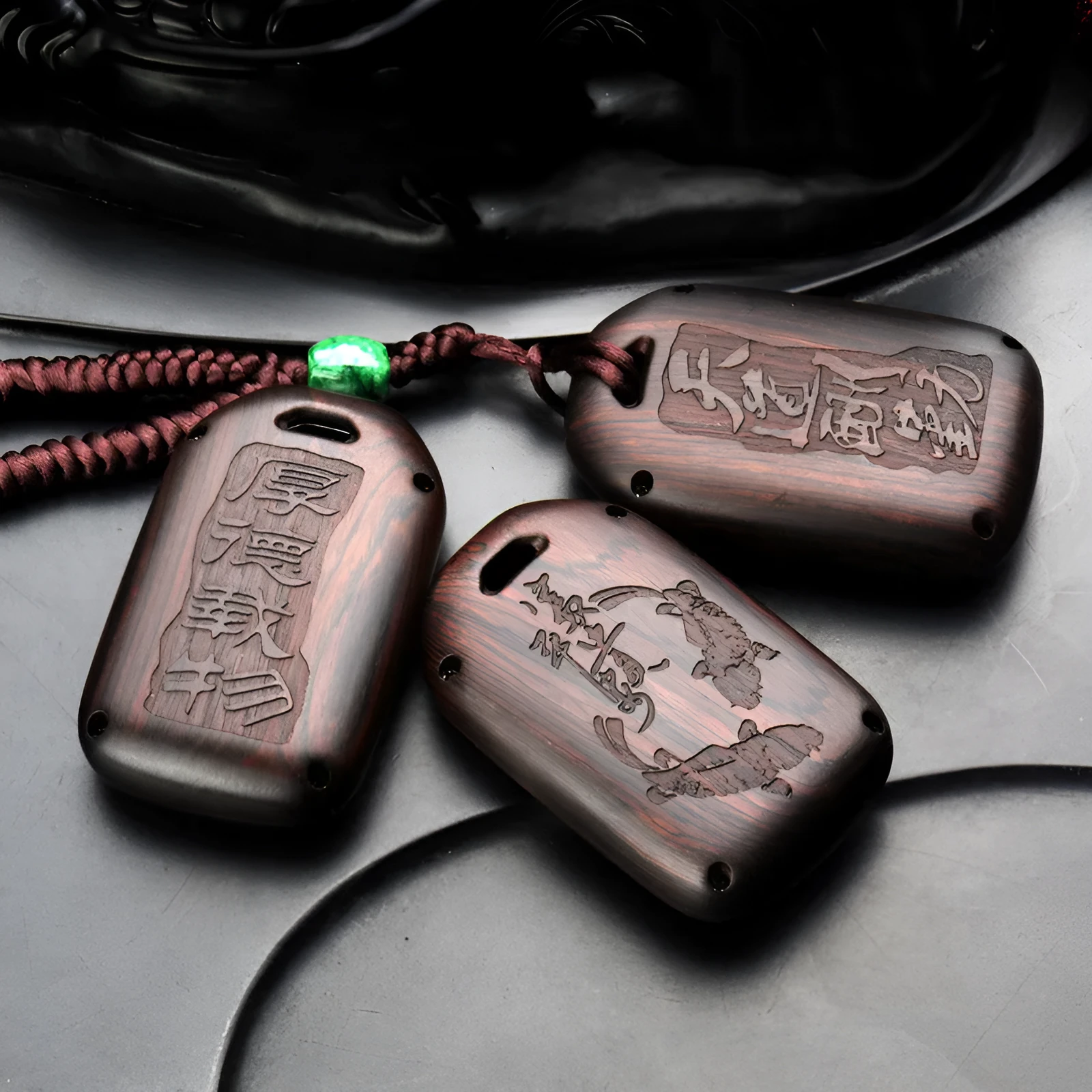 Solid ebony sandalwood key case with key rings, showing carved wood grain on a plain background