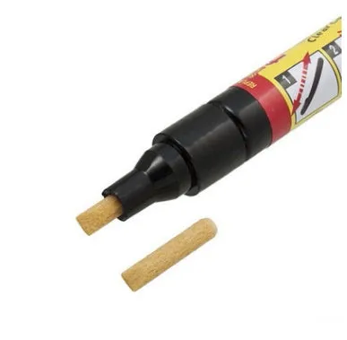 Transoceanic car touch-up pen with clear coat repair resin in aluminum tube, on surface