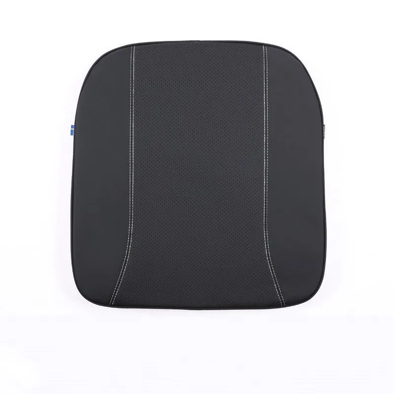 Minimalist brown synthetic fibre headrest and lumbar support cushion for a Volvo car seat.