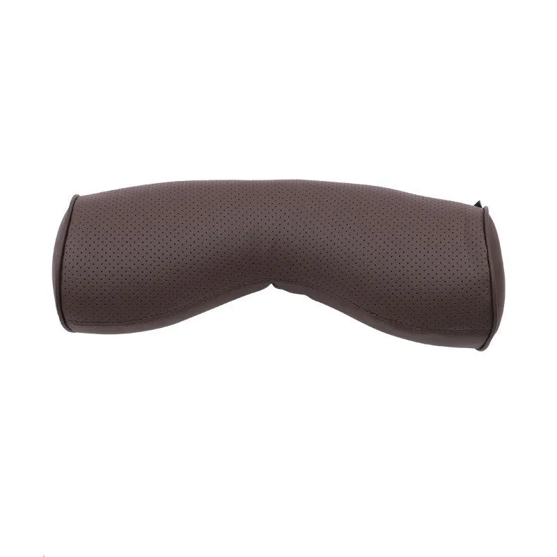 Minimalist brown synthetic fibre headrest and lumbar support cushion for a Volvo car seat.