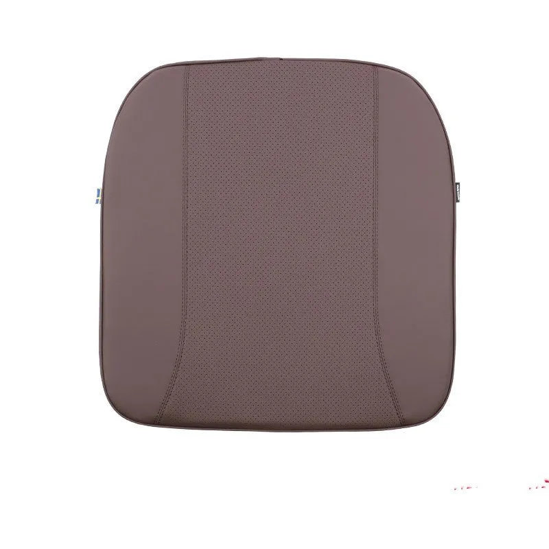 Minimalist brown synthetic fibre headrest and lumbar support cushion for a Volvo car seat.