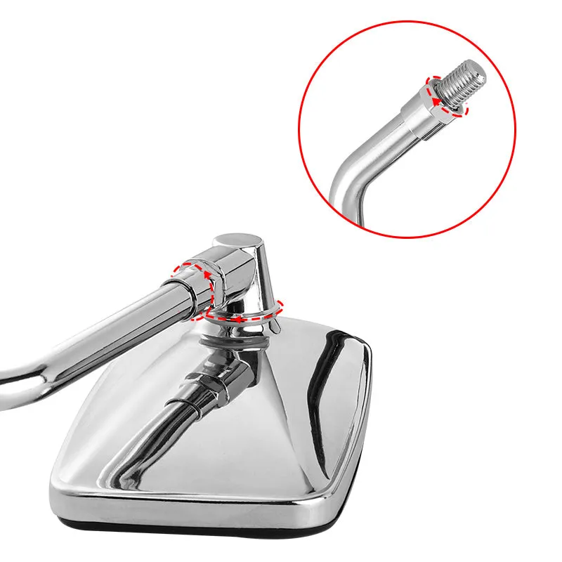 Silver all-metal motorcycle rearview mirror with convex lens on a dark background