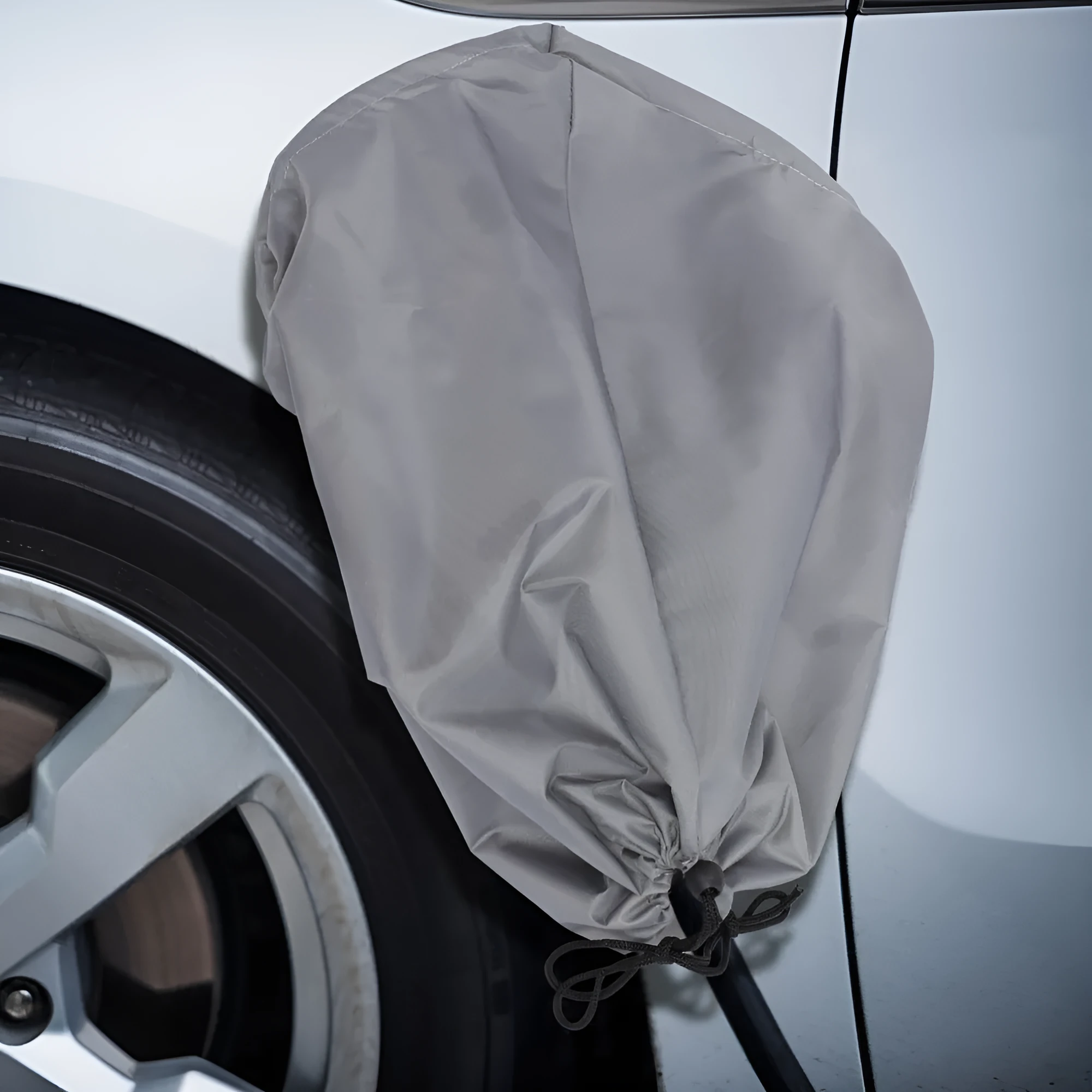 Waterproof cover for electric vehicle charging port with drawstring closure