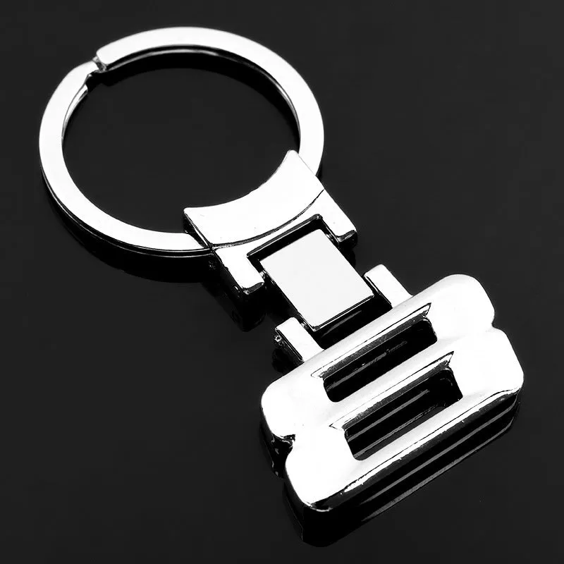Zinc alloy metal keychain 67mm long on a wooden surface with a set of keys attached