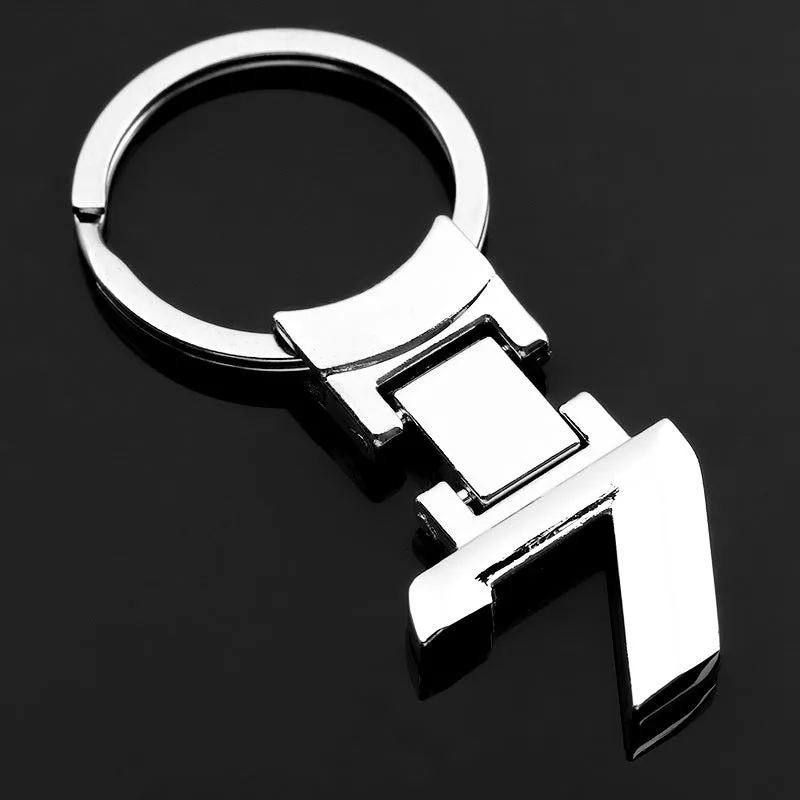 Zinc alloy metal keychain 67mm long on a wooden surface with a set of keys attached