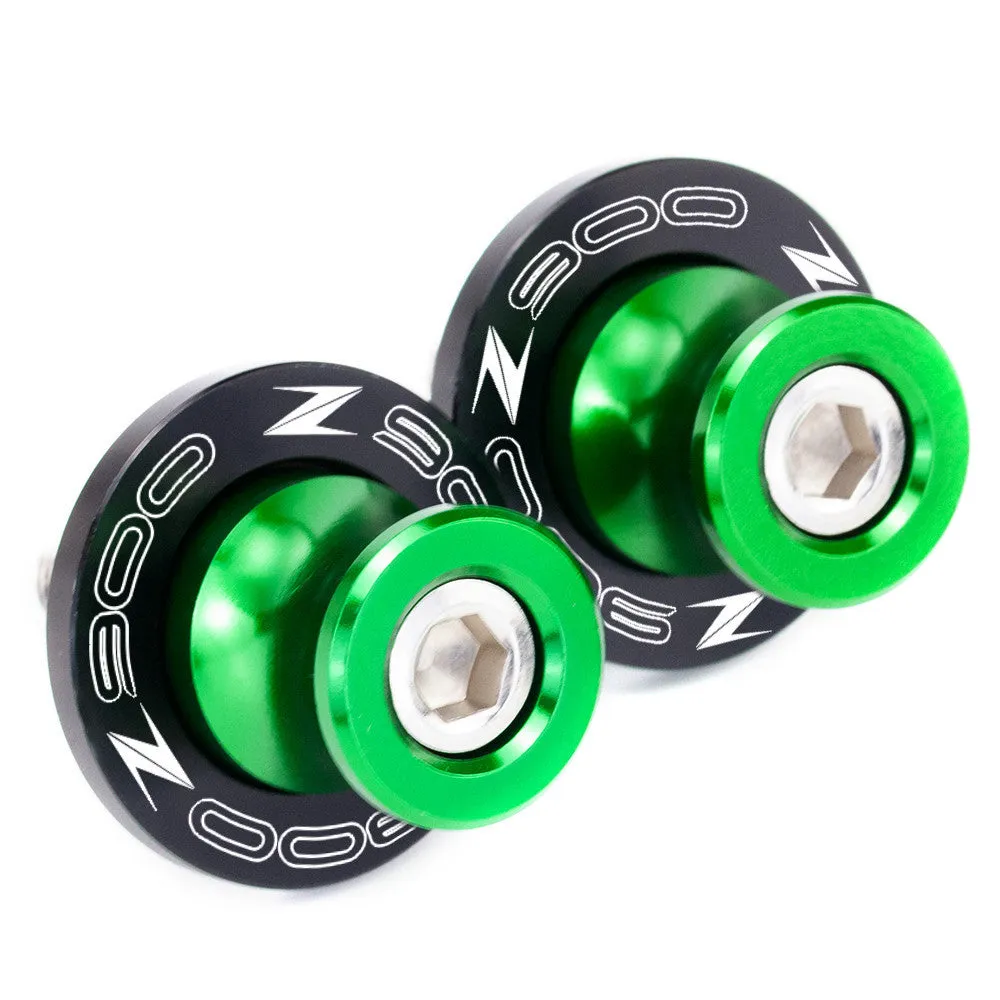 Pair of CNC aluminium swingarm spools for Kawasaki Z650 Z900 in anodised colour, with Delrin sliders and stainless steel bolts