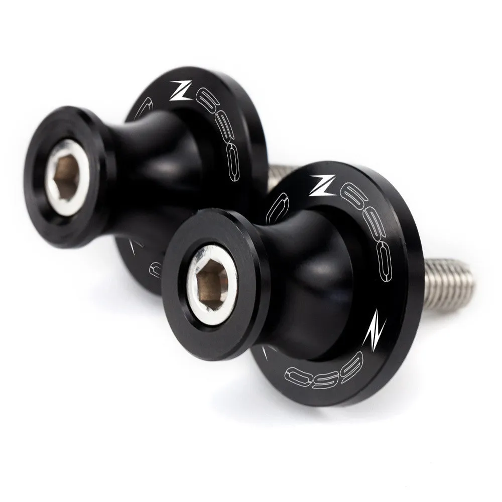 Pair of CNC aluminium swingarm spools for Kawasaki Z650 Z900 in anodised colour, with Delrin sliders and stainless steel bolts
