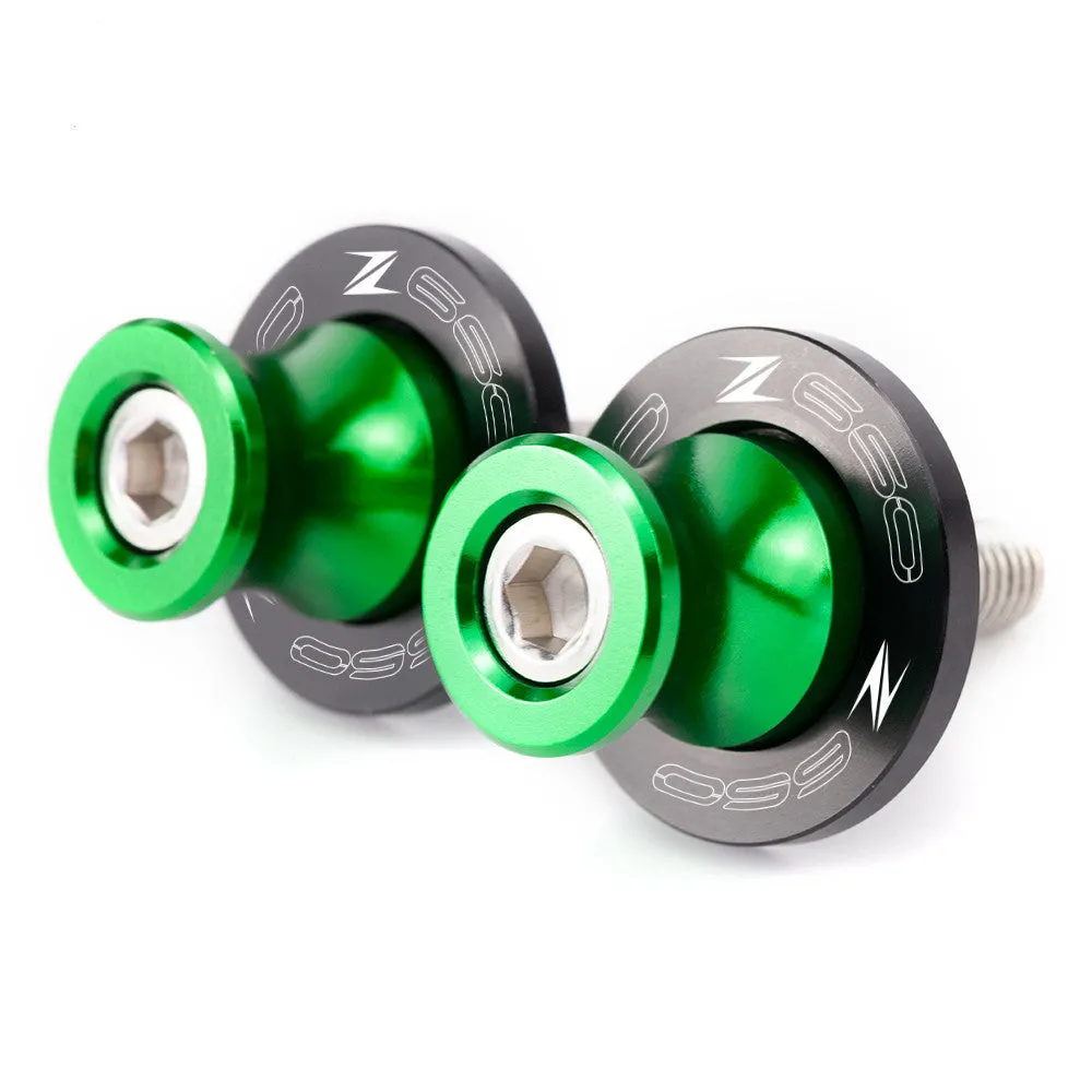 Pair of CNC aluminium swingarm spools for Kawasaki Z650 Z900 in anodised colour, with Delrin sliders and stainless steel bolts