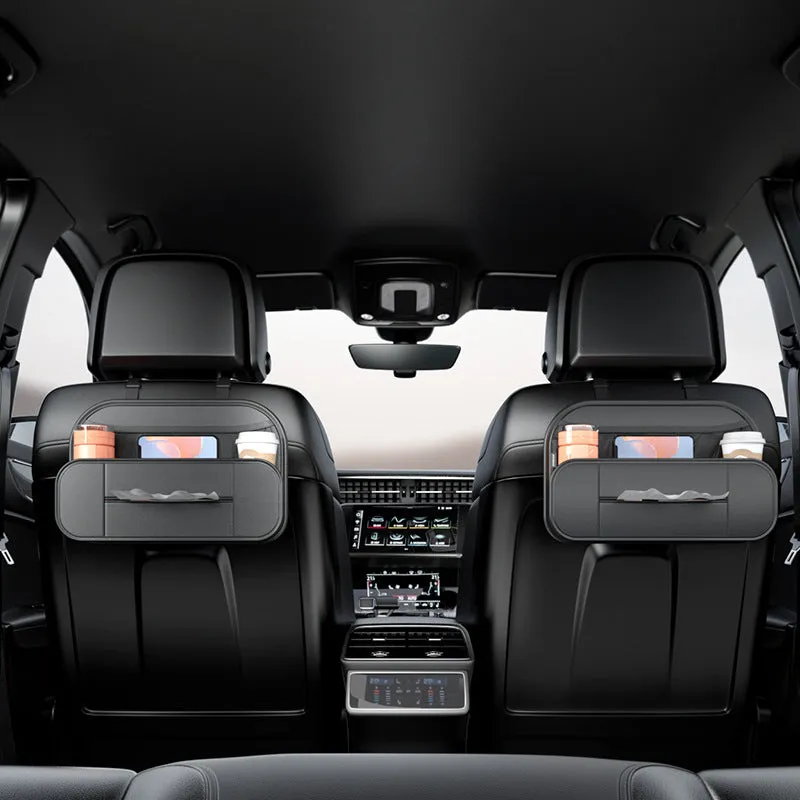 Black leather car seat storage bag with customisable compartments mounted on vehicle seatback