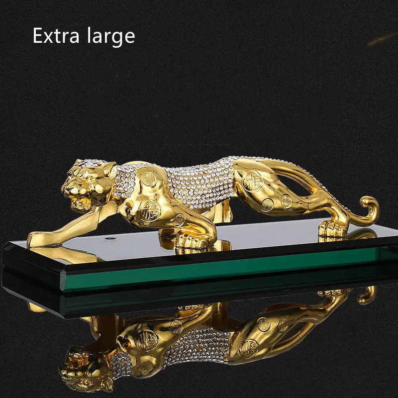 Leopard car perfume ornament made of alloy crystal base plate and resin in gold finish on car dashboard