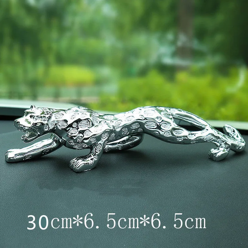 Leopard car perfume ornament made of alloy crystal base plate and resin in gold finish on car dashboard
