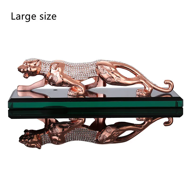 Leopard car perfume ornament made of alloy crystal base plate and resin in gold finish on car dashboard