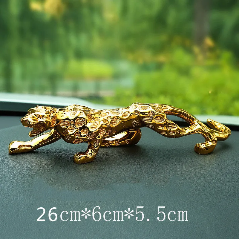 Leopard car perfume ornament made of alloy crystal base plate and resin in gold finish on car dashboard
