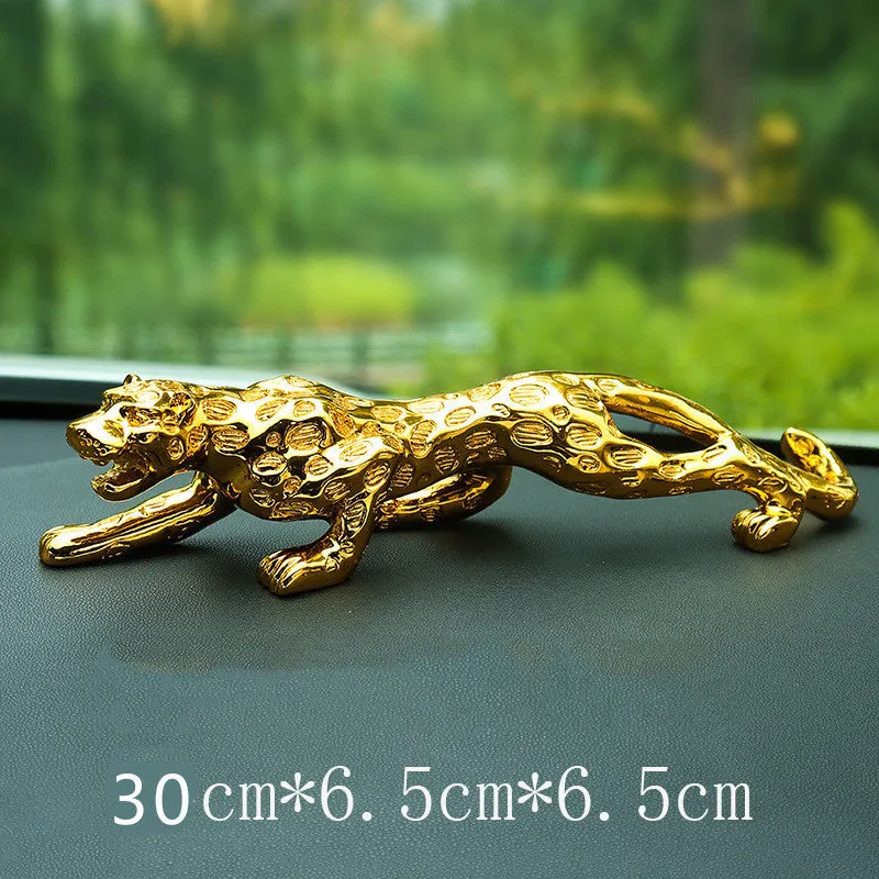 Leopard car perfume ornament made of alloy crystal base plate and resin in gold finish on car dashboard