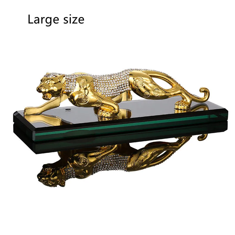 Leopard car perfume ornament made of alloy crystal base plate and resin in gold finish on car dashboard