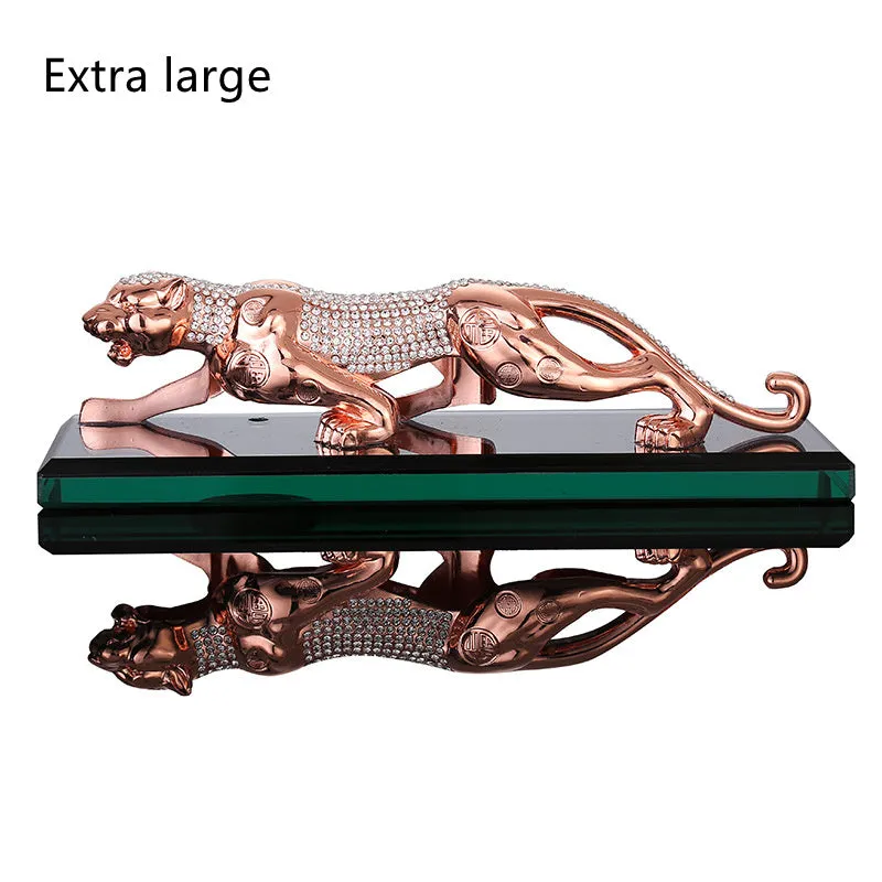 Leopard car perfume ornament made of alloy crystal base plate and resin in gold finish on car dashboard