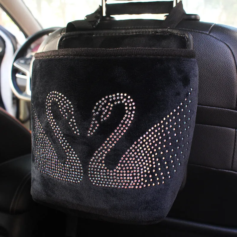Nylon car seat storage net pocket 27x39x10cm in black, fitted between front seats